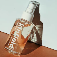 a bottle of knifefield body mist sitting on a table