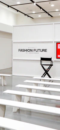 a white room with benches and a tv