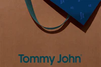 tommy john's logo on a brown shopping bag