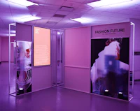 a room with a purple light and a display